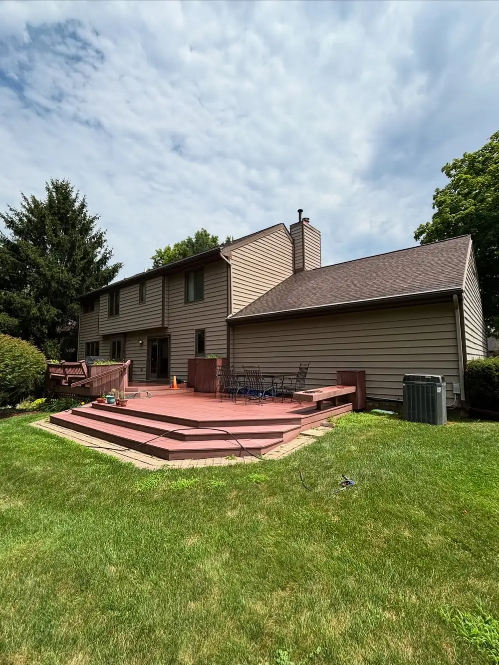 Backyard deck and rear exterior of a two-storey home in Okemos, MI