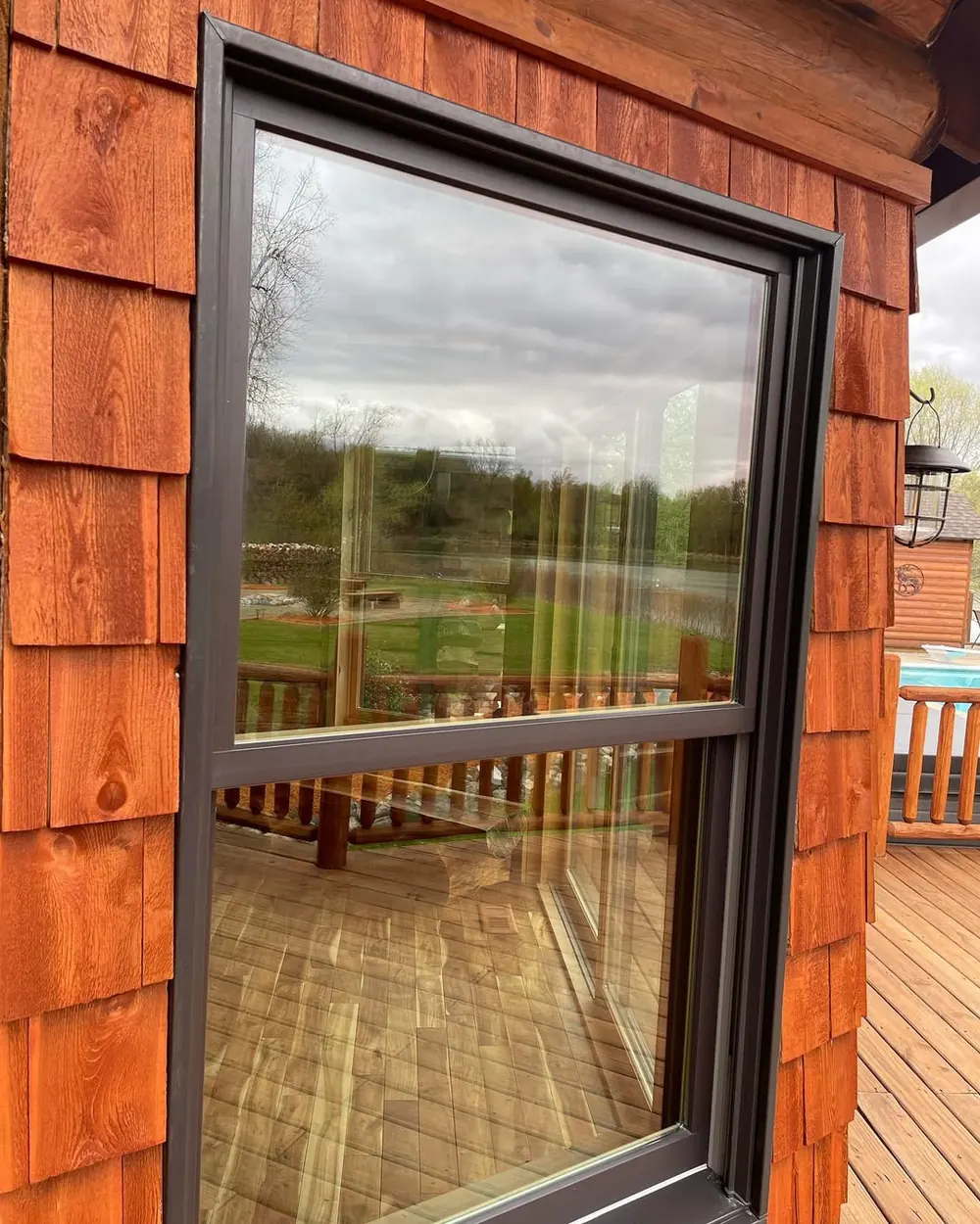 Clean cedar-trimmed window closeup after window cleaning in Okemos, MI