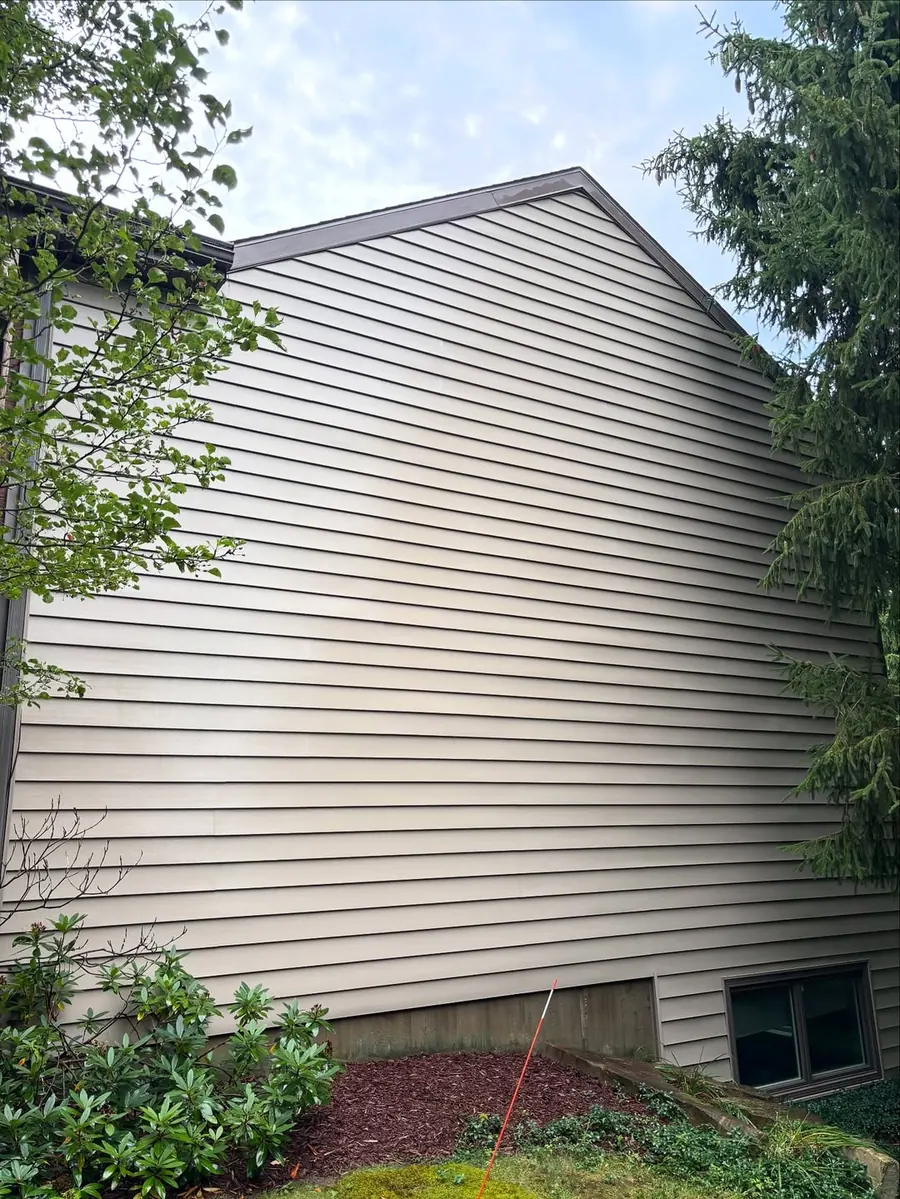 Bright clean siding after professional house washing in Okemos, MI