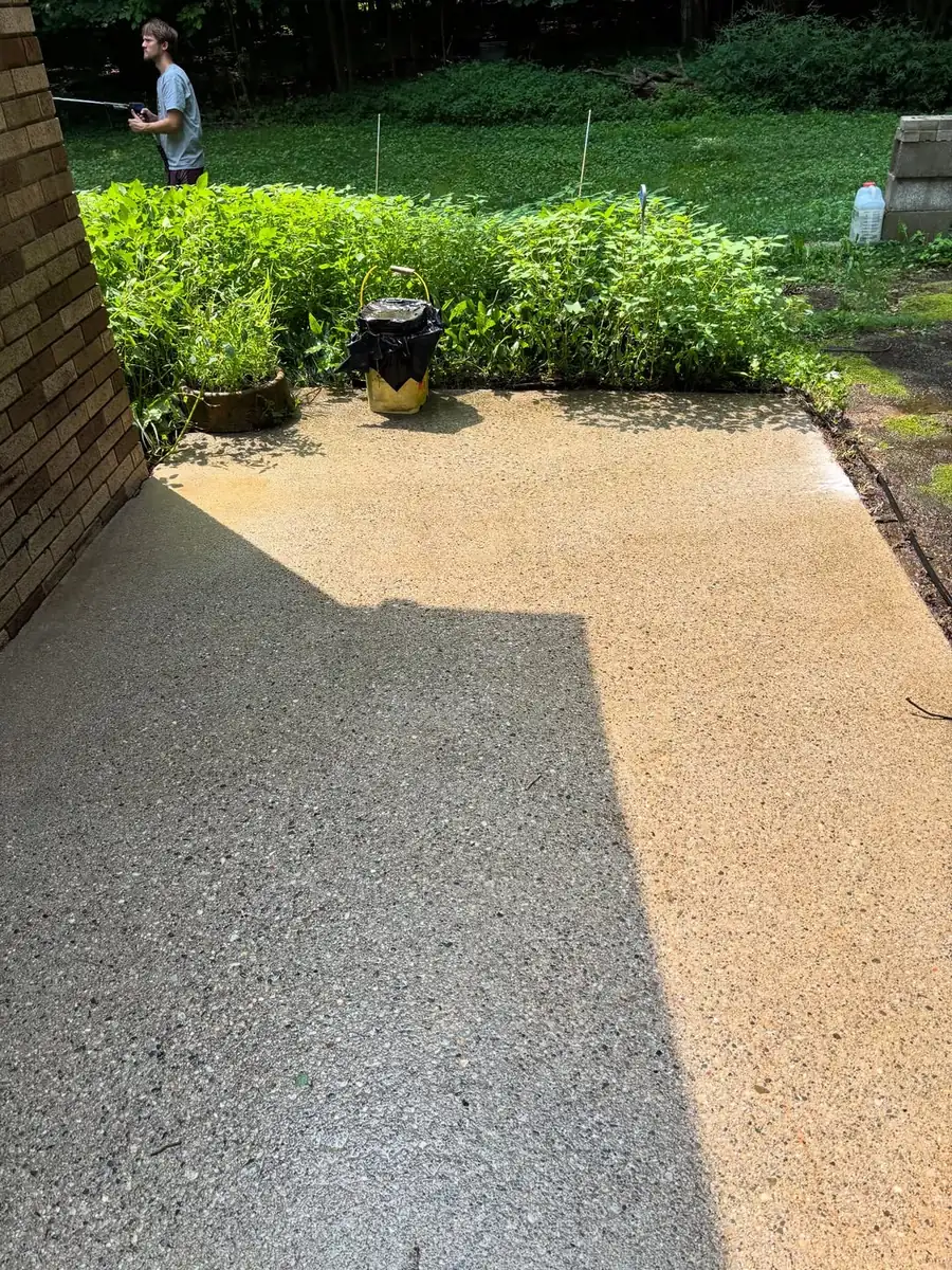 Restored patio concrete after cleaning and concrete sealing in Okemos, MI
