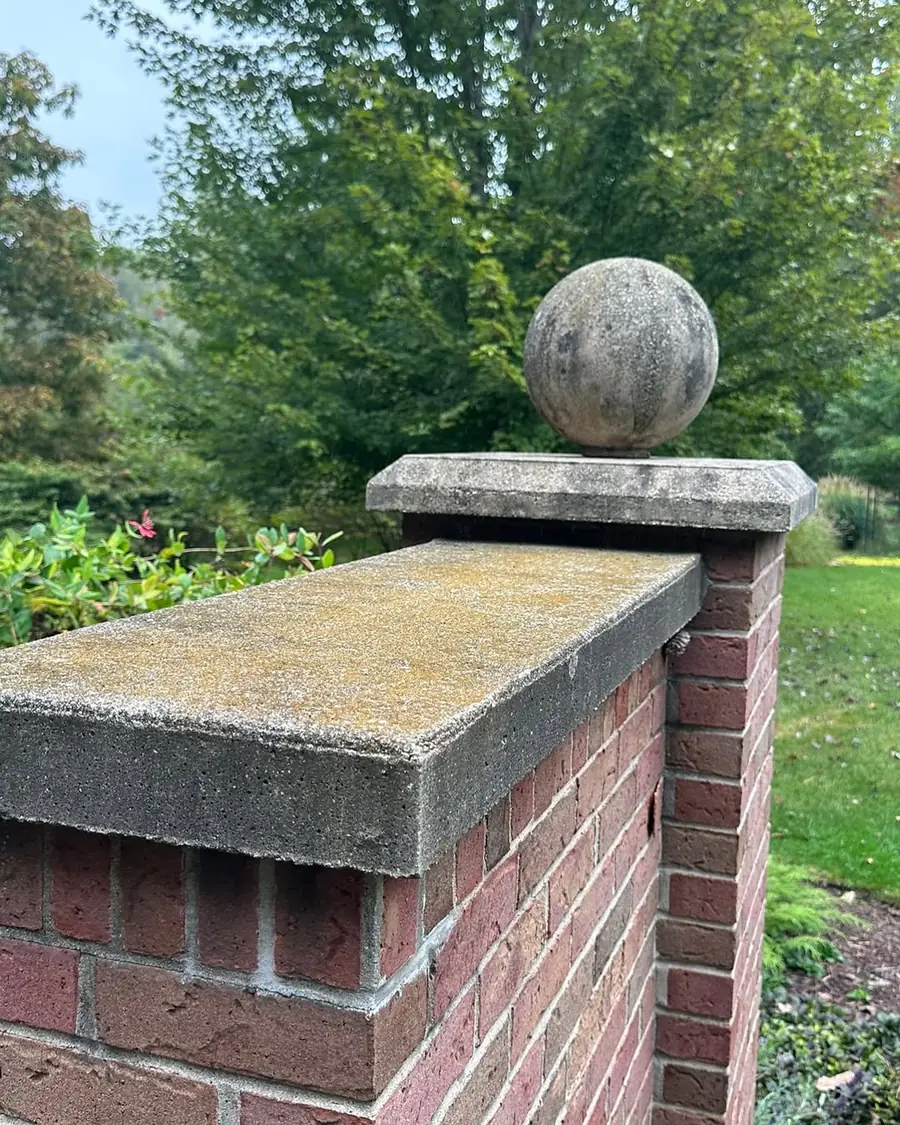 Dirty brick pillar before professional exterior cleaning in Okemos, MI