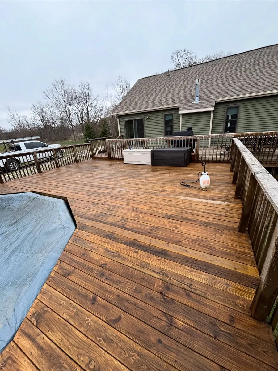 Clean wood deck after professional exterior cleaning in Okemos, MI