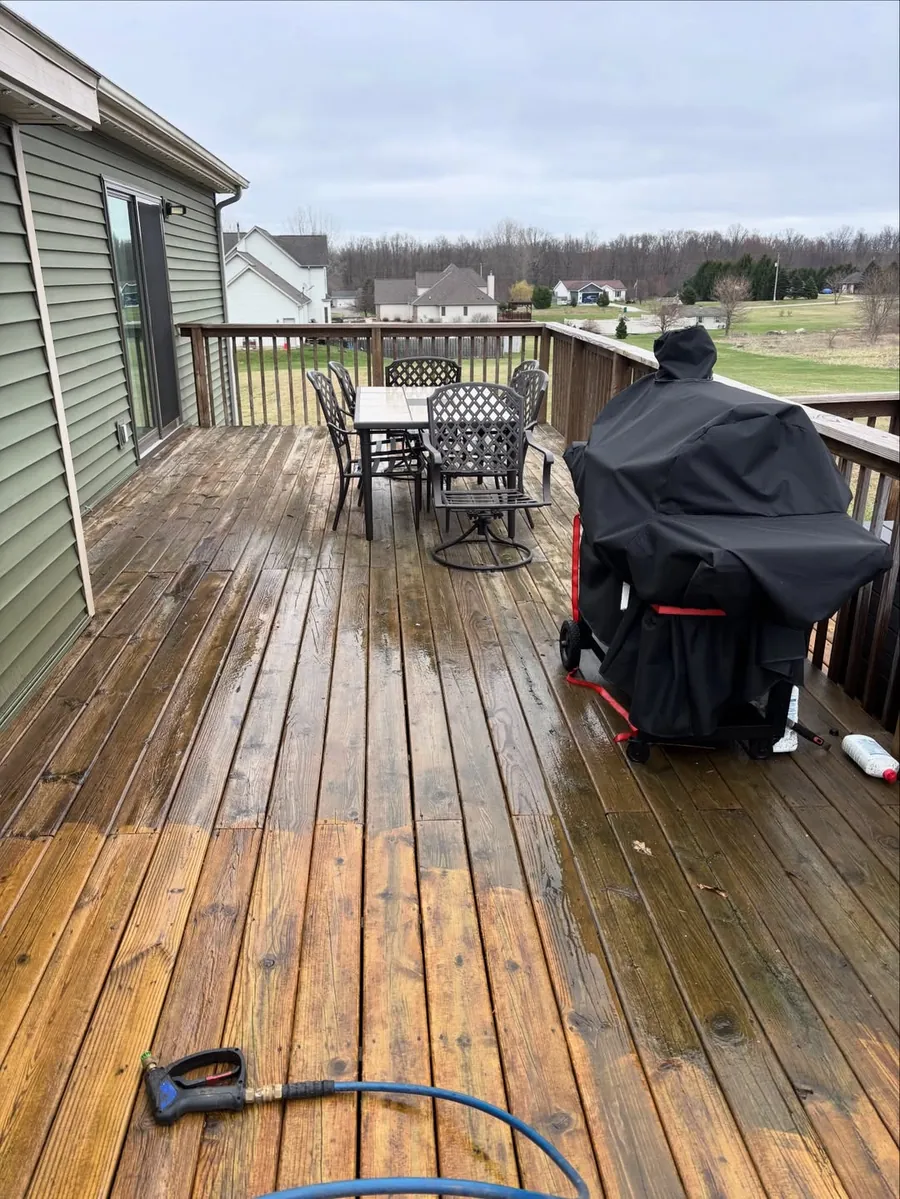 Deck stained with dirt and algae before deck cleaning in Okemos, MI