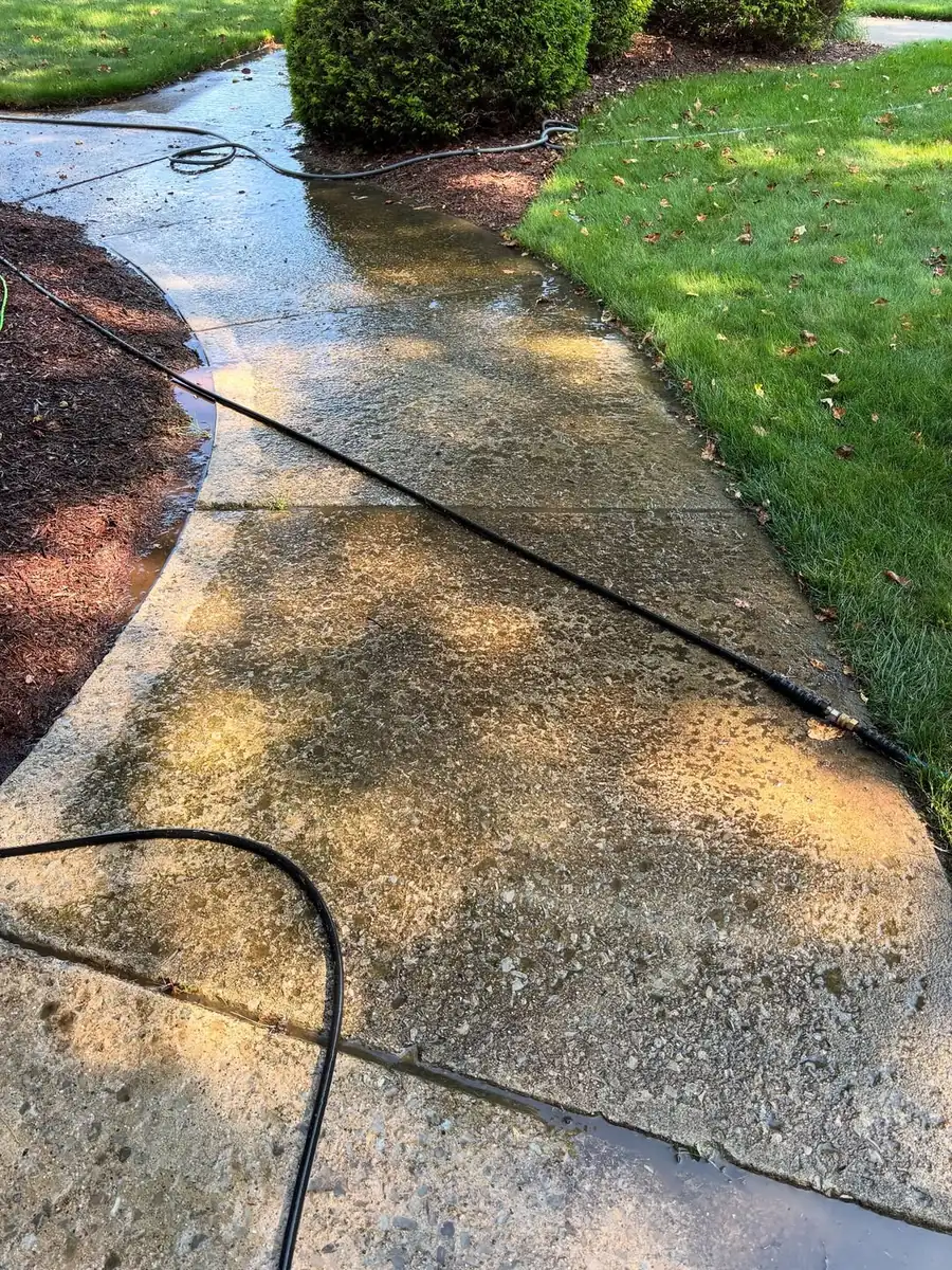 Dirty stained walkway before concrete sealing in Okemos, MI