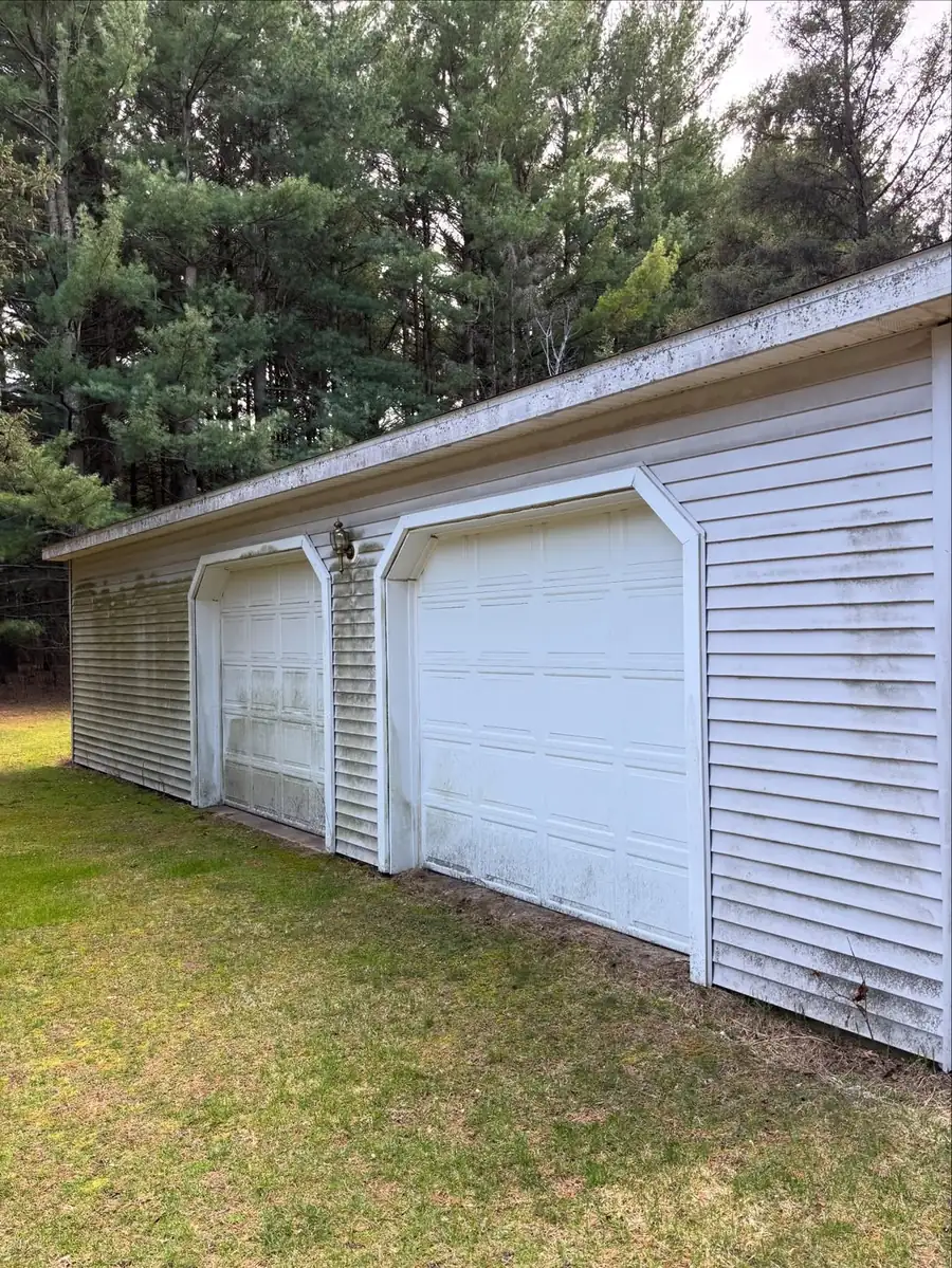 Dirty home siding before professional exterior cleaning in Okemos, MI