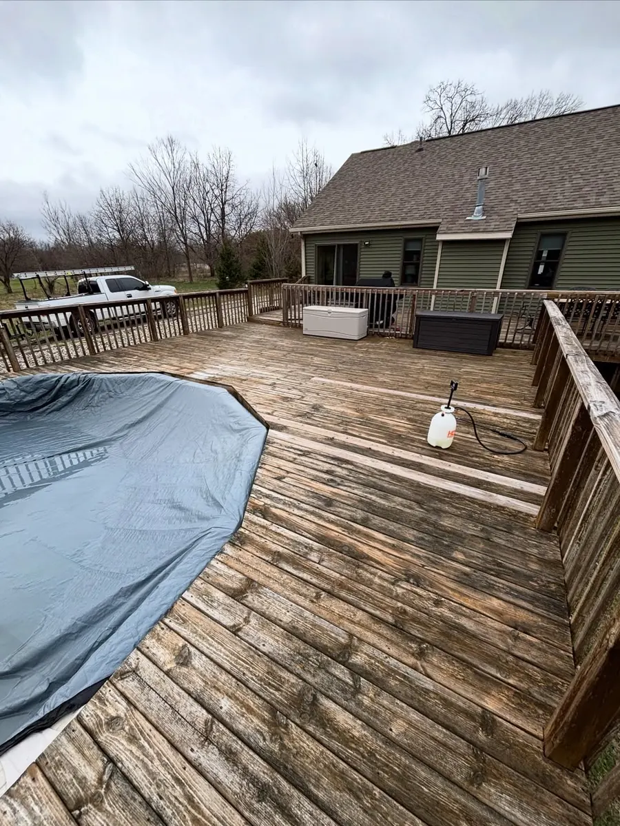 Dirty wood deck before professional exterior cleaning in Okemos, MI