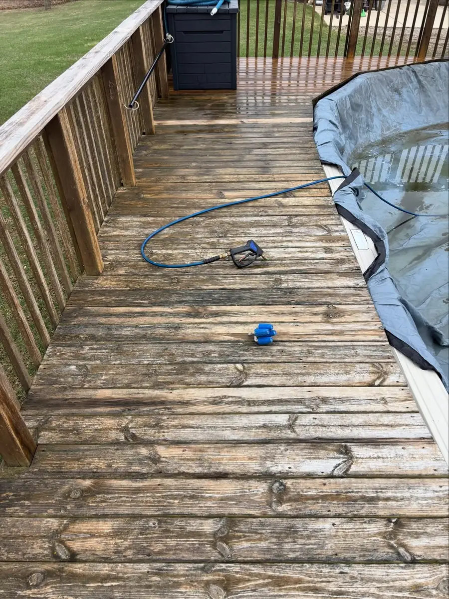 Weathered wood deck covered in buildup before deck cleaning in Okemos, MI